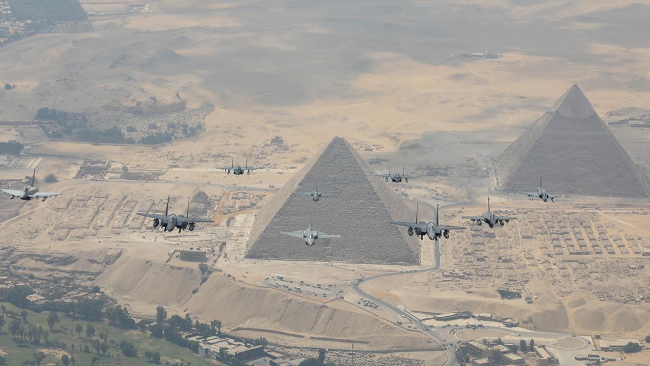 A squadron of F-16s cross the Pyramids during Bright Star exercise