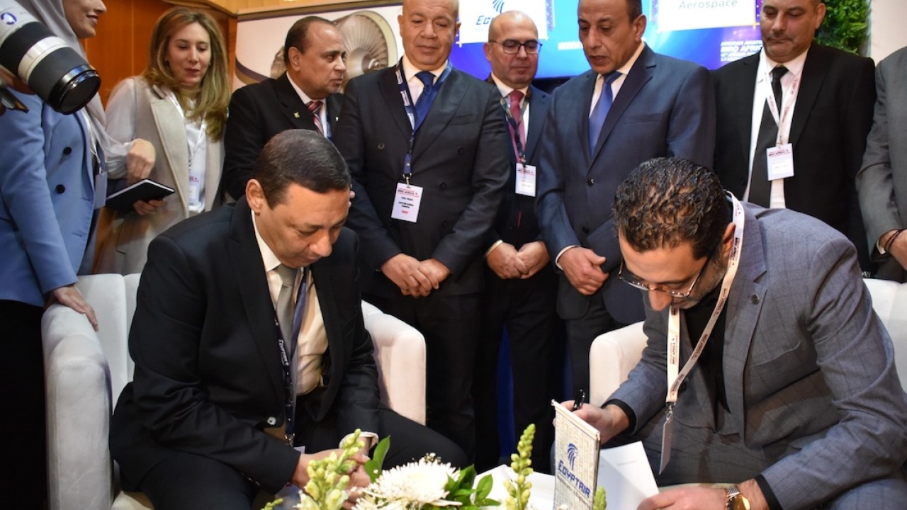 El-Khafif (seated left) signs an agreement with Petra Aerospace